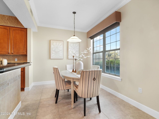 415 N Ocean Grande Dr Unit 102, Ponte Vedra Beach, FL 32082 - tiled dining space with crown molding