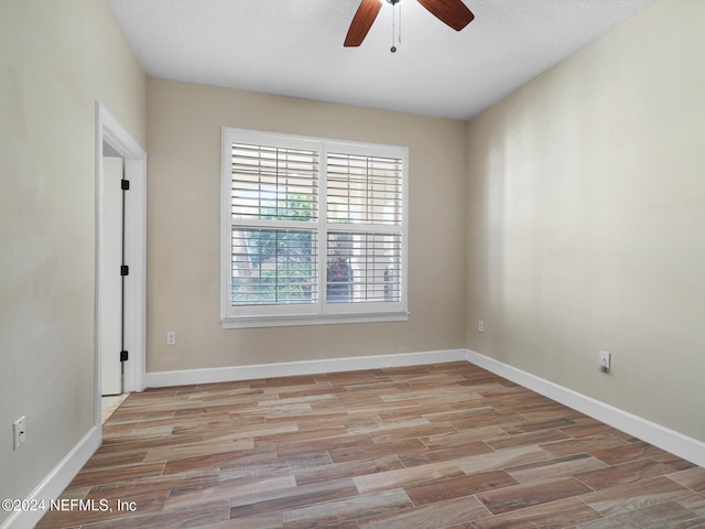 415 N Ocean Grande Dr Unit 102, Ponte Vedra Beach, FL 32082 - spare room with a textured ceiling, light wood-type flooring, and ceiling fan