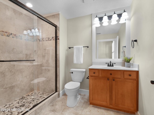 415 N Ocean Grande Dr Unit 102, Ponte Vedra Beach, FL 32082 - bathroom featuring vanity, a textured ceiling, toilet, and an enclosed shower