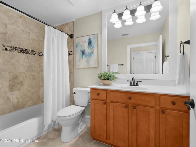 415 N Ocean Grande Dr Unit 102, Ponte Vedra Beach, FL 32082 - full bathroom with tile patterned floors, toilet, shower / tub combo, vanity, and a textured ceiling