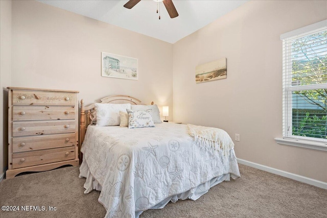 bedroom with carpet, multiple windows, and ceiling fan