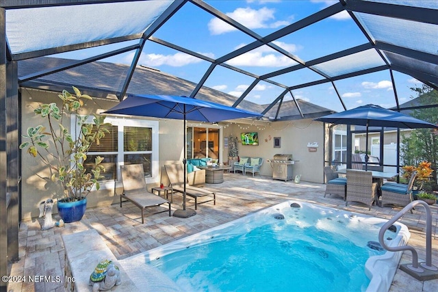 view of pool featuring a grill, a lanai, and a patio