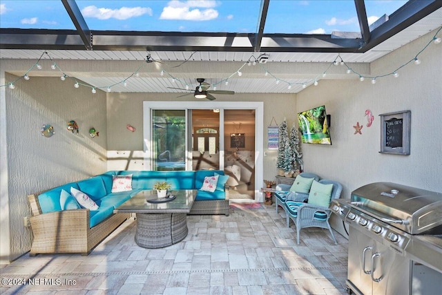 view of patio with ceiling fan, area for grilling, and an outdoor hangout area