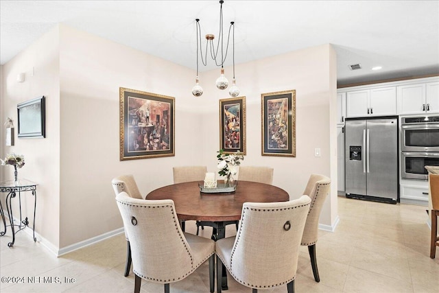 dining room featuring light tile patterned flooring