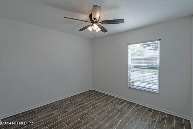 spare room featuring ceiling fan and a textured ceiling