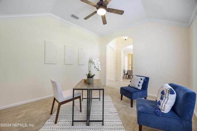 carpeted home office featuring crown molding, lofted ceiling, and ceiling fan