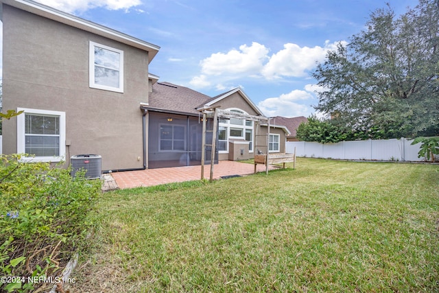 view of yard with a patio area and central AC