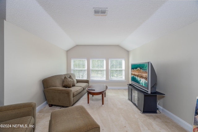 living room with light carpet, baseboards, visible vents, lofted ceiling, and a textured ceiling