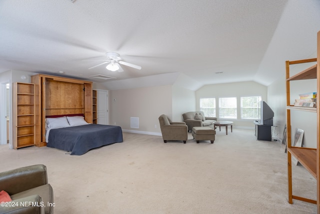 bedroom featuring lofted ceiling, light carpet, ceiling fan, a textured ceiling, and baseboards