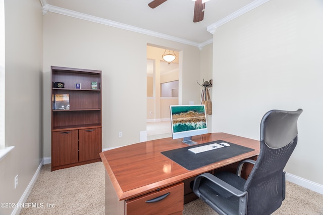 office area featuring ceiling fan, baseboards, light colored carpet, and ornamental molding