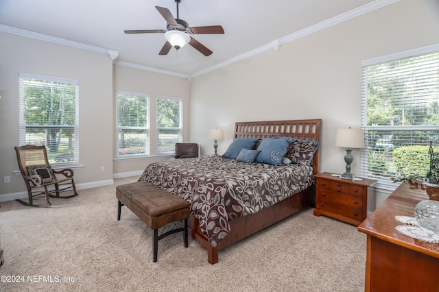 bedroom featuring a ceiling fan, light colored carpet, crown molding, and baseboards