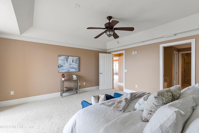 carpeted bedroom with ornamental molding, a textured ceiling, and ceiling fan