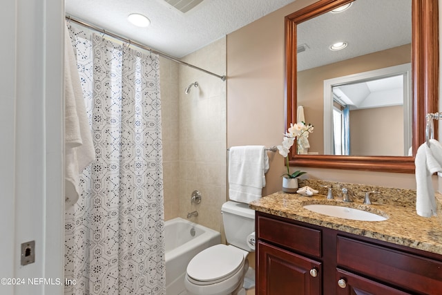 full bathroom with vanity, toilet, a textured ceiling, and shower / tub combo with curtain