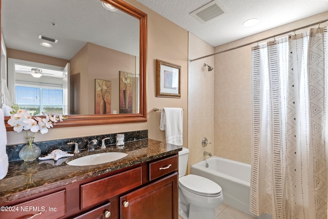 full bathroom with ceiling fan, shower / tub combo, a textured ceiling, toilet, and vanity