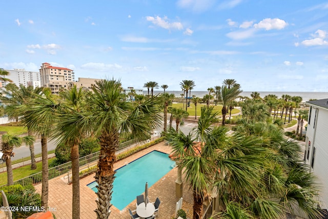 view of pool with a water view