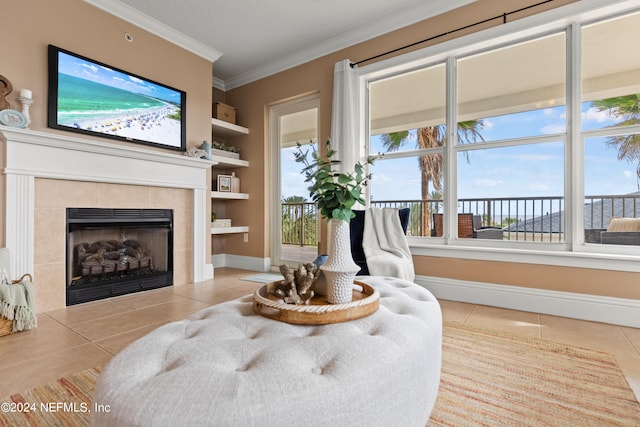 living room with ornamental molding, light tile patterned flooring, a fireplace, and built in shelves