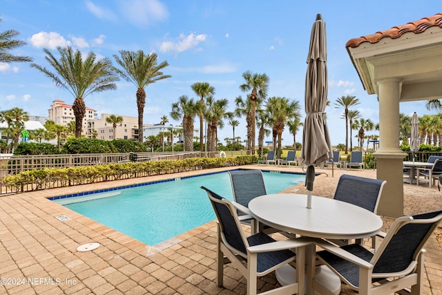 view of swimming pool featuring a patio area