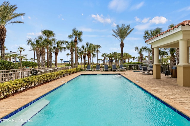 view of swimming pool featuring a patio