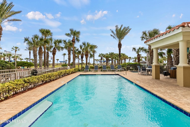 view of pool featuring a patio and a gazebo