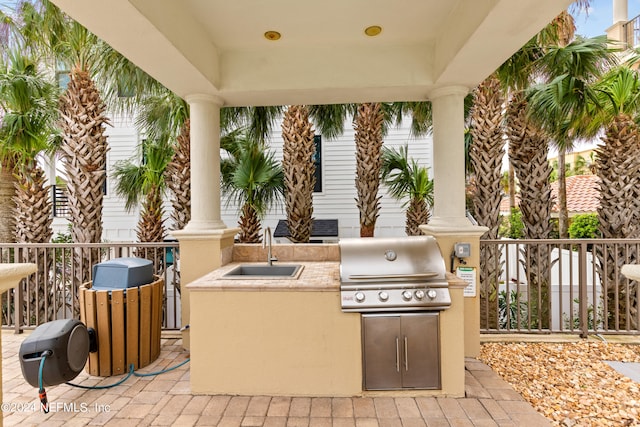 view of patio / terrace with area for grilling and sink