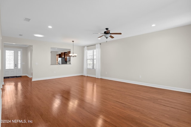 272 Hammocks Landing Dr, Ponte Vedra, FL 32081 - unfurnished living room with wood finished floors, ceiling fan with notable chandelier, visible vents, baseboards, and recessed lighting