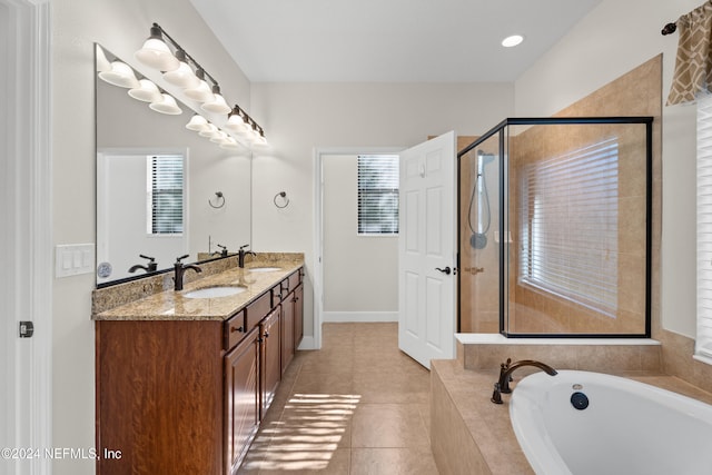 bathroom featuring vanity, tile patterned floors, and plus walk in shower