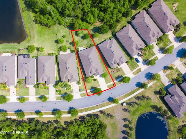 birds eye view of property featuring a water view