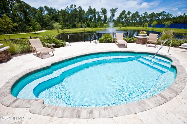 272 Hammocks Landing Dr, Ponte Vedra, FL 32081 - view of pool featuring a patio area, a water view, fence, and a swimming pool