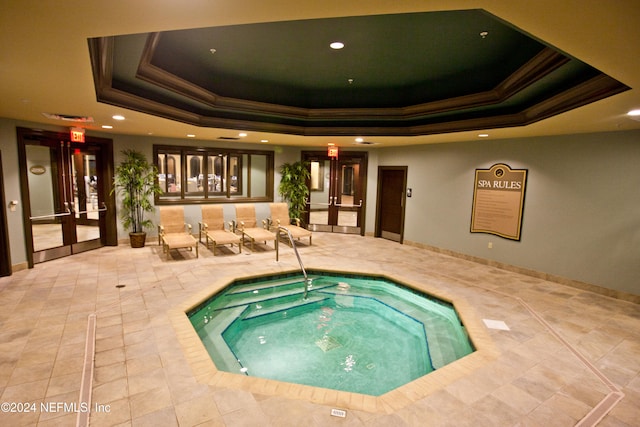 view of swimming pool with french doors