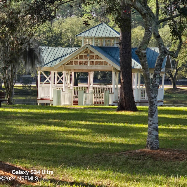 view of front facade with a front yard and a gazebo