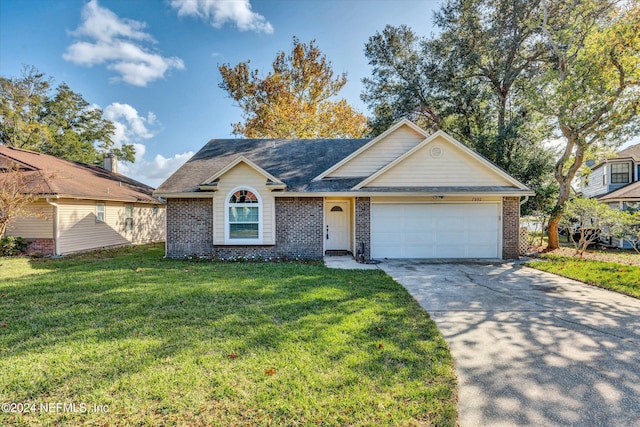 ranch-style house featuring a garage and a front lawn