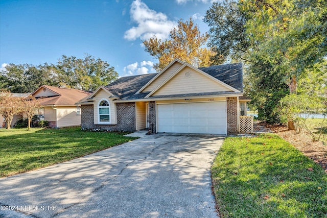 single story home with a garage and a front yard