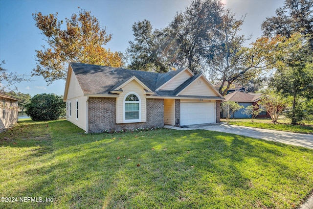 view of front of home featuring a front lawn and a garage