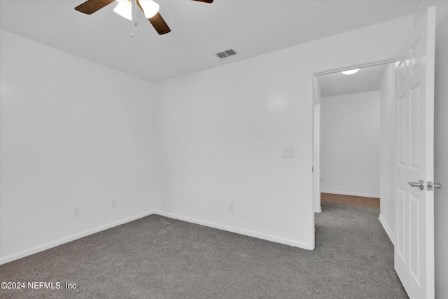 carpeted empty room with ceiling fan