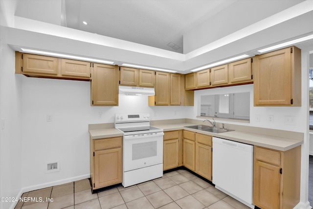 kitchen featuring light brown cabinetry, white appliances, sink, and light tile patterned floors