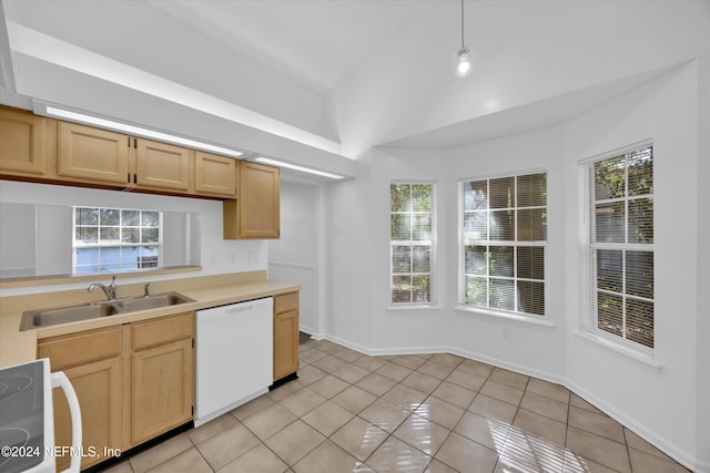 kitchen with hanging light fixtures, white dishwasher, and plenty of natural light