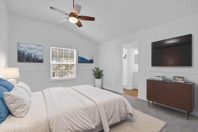 carpeted bedroom featuring vaulted ceiling and ceiling fan