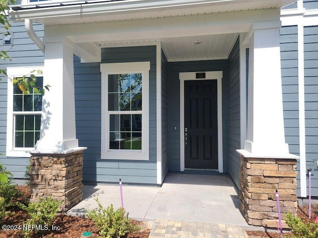 entrance to property with a porch