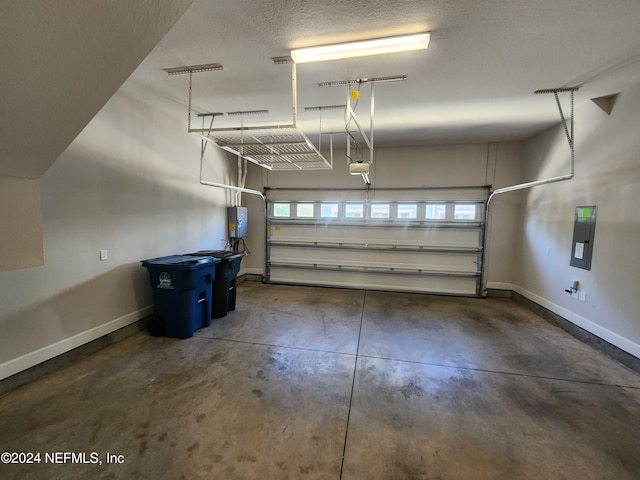 garage featuring electric panel and a garage door opener