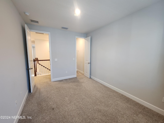 unfurnished bedroom with carpet