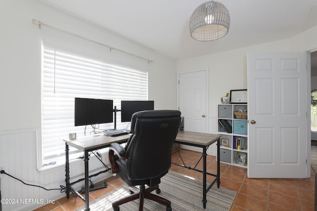 home office with tile patterned floors