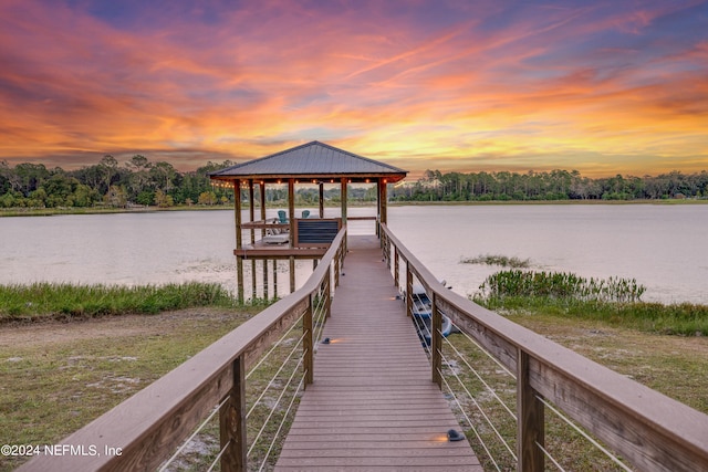 view of dock featuring a water view and a gazebo