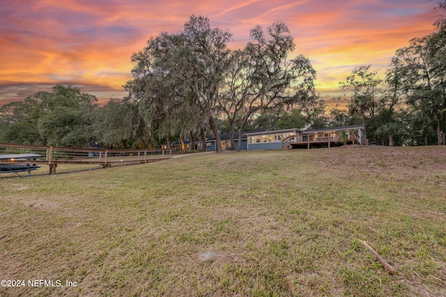 view of yard at dusk