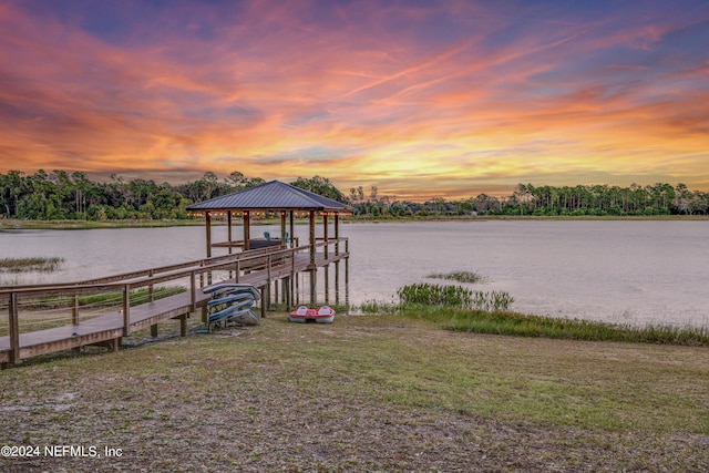 dock area with a gazebo and a water view