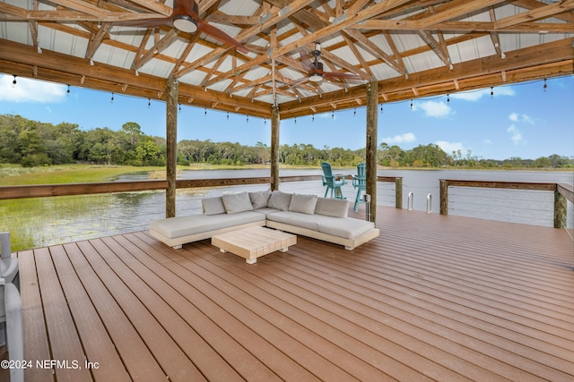 view of dock with a gazebo and a water view