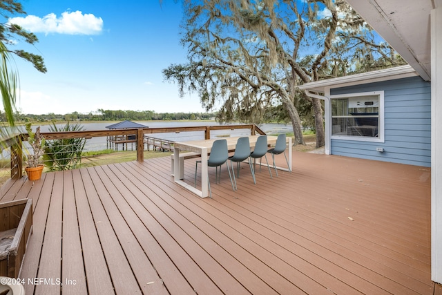 deck featuring a water view