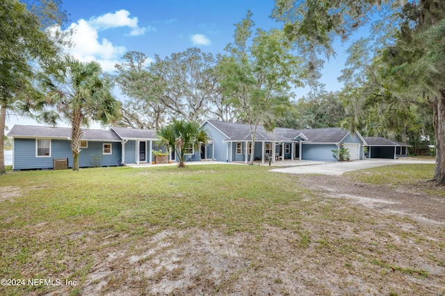 ranch-style house with a front yard and a garage