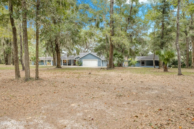 ranch-style house featuring a garage