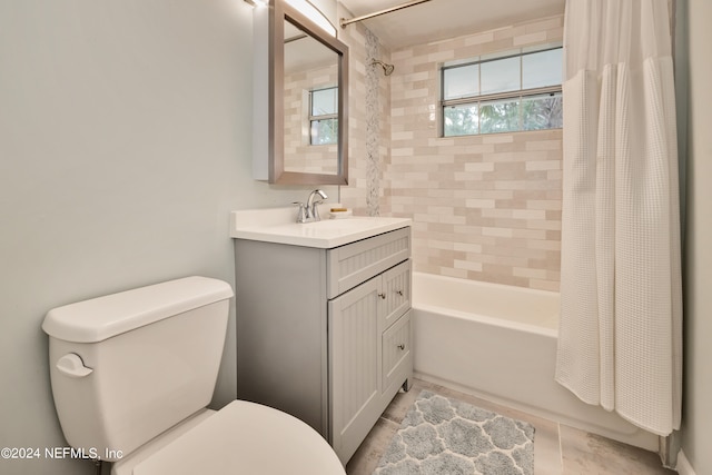 full bathroom with toilet, shower / bath combo, vanity, and tile patterned flooring