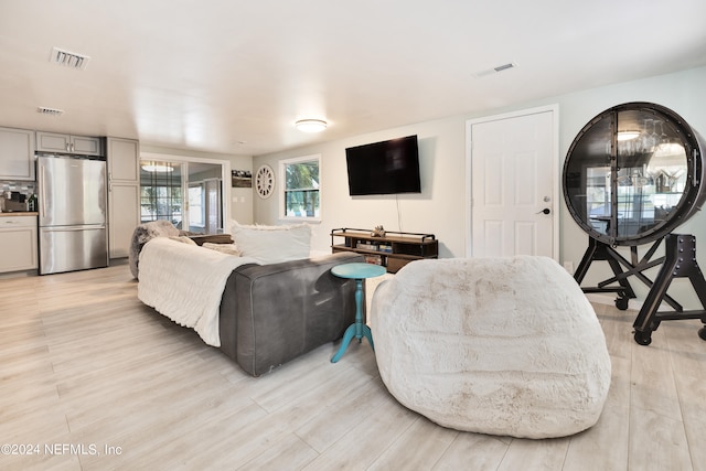 living room with light hardwood / wood-style flooring